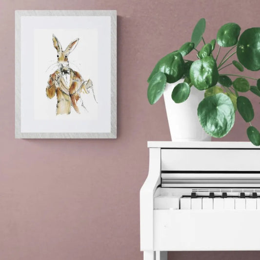 Whimsical jazz singer hare art print framed above white piano