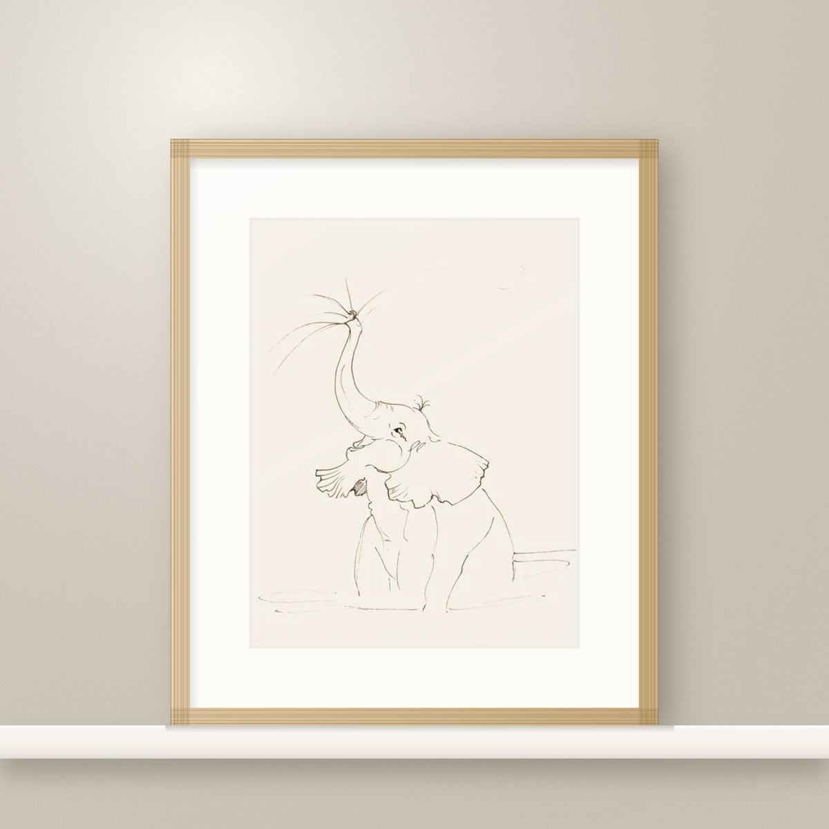 Full Of Joy elephant print in an oak frame on a nursery shelf