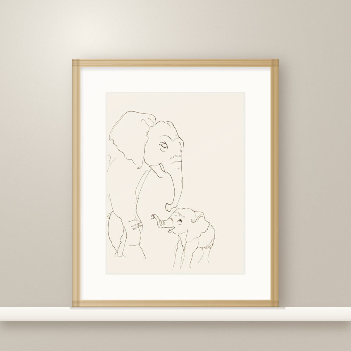 I'm Here elephant print in an oak frame on a nursery shelf